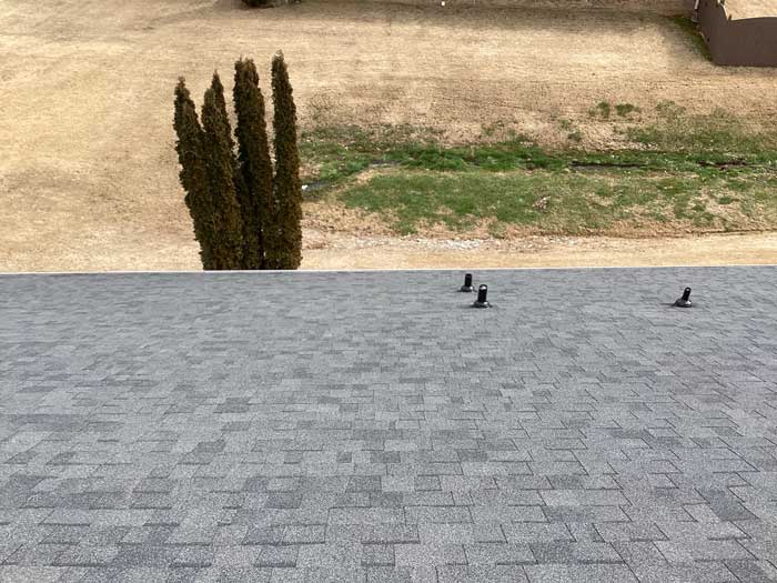 Overhead view of shingle roof with clean alignment and finish