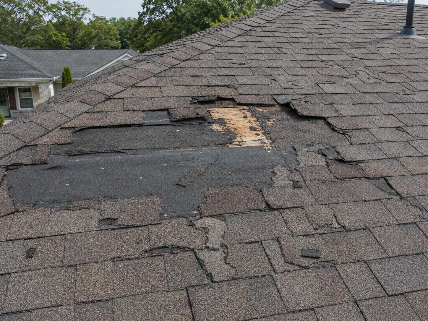 ChatGPT Image Jun 24, 2026, 02_25_50 AM Storm-damaged roof with missing shingles on a home in Atlanta, Georgia
